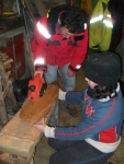 Douglas and Marianne test the repaired electric planer.